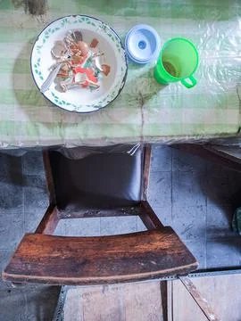 The dining table is in a mess. A messy dining table with used dishes and full Stock Photos