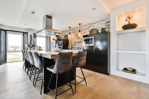 Dining table in modern kitchen Stock Photos