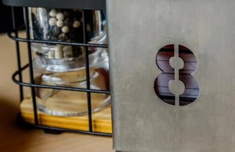 Dining table number eight in the restaurant. Stock Photos