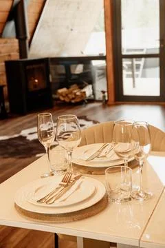 Dining Table Place Setting in Cozy Wooden Cabin Stock Photos