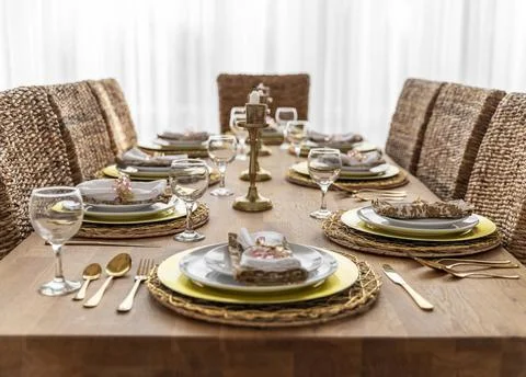 Dining table with plates Stock Photos
