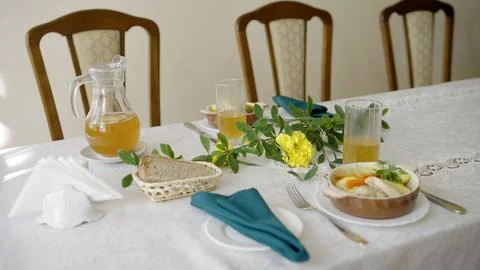Dining table set with food and drinks for a home meal Stock-Fotos