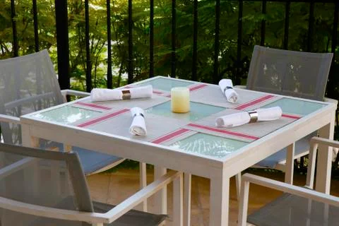 Dining table set up in open terrace with beautiful nature view Stock Photos