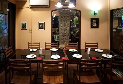 Dining table set in the room of Thai restaurant on Soi Aree, Phahonyothin Road Фото