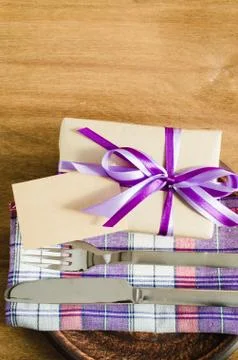 Dining Table Setting with Empty Tag and Present. Stock Photos