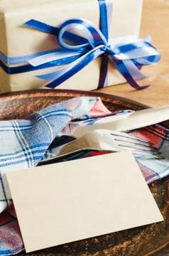 Dining Table Setting with Empty Tag and Present. Stock Photos