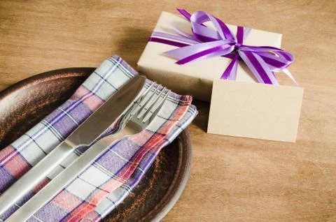 Dining Table Setting with Empty Tag and Present. Stock Photos