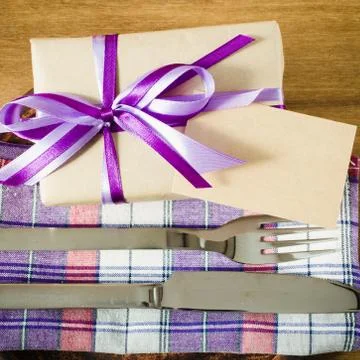 Dining Table Setting with Empty Tag and Present. Stock Photos