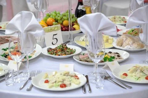 Dining table setting at Provence style, with candles, lavender, vintage crockery Stock Photos