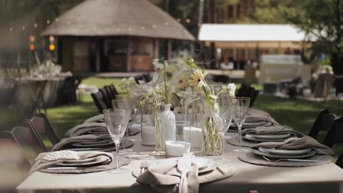 Dining table setting, wedding table setting. Close up of decorations flowers Stock Footage 308450742