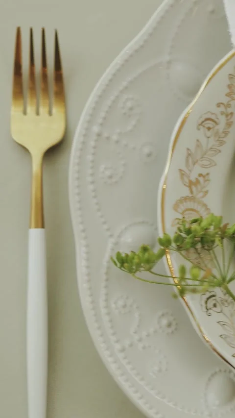 Dining table setting with a white plate and napkin at a wedding or event Stock Footage 308398693