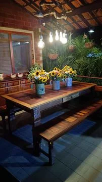 Dining table with sunflowers Stock Photos