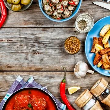 Dining table with a variety of meals 写真素材