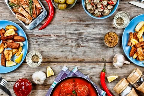 Dining table with a variety of meals Photos