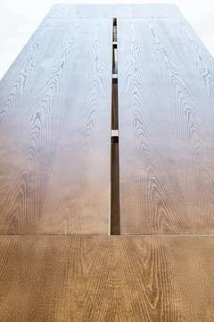 Dining table of veneer and solid ash stands on open terrace Stock Photos