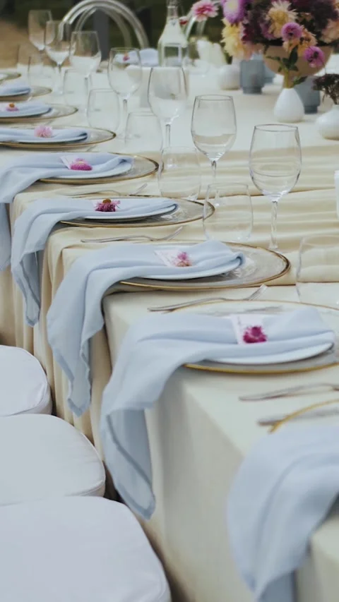 Dining table at a wedding in an outdoor restaurant with elegant decor elements Stock Footage 314270154