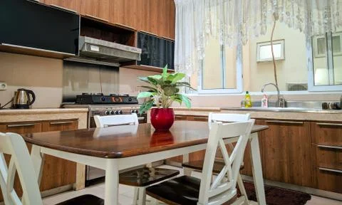 Dining tables in kitchen room Stock Photos