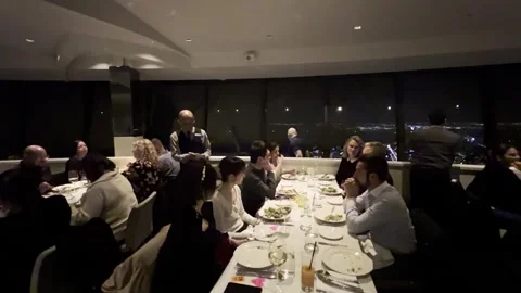Dining at toronto rotating restaurant in cn tower Stock Footage 284452123