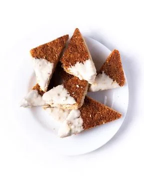 Dining view of triangular-shaped ginger and honey cookies Fotos de archivo