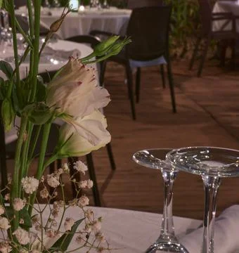 Dinner with candle lanterns on a summer restaurant terrace. 2 Stock Photos