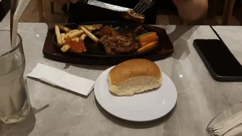 Dinner, Eating Chicken Steak Stockbeeldmateriaal 342285625