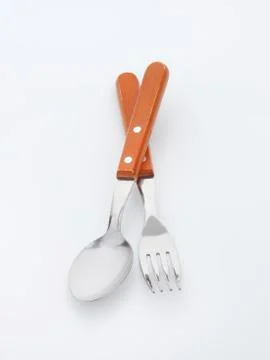 Dinner fork and spoon with wooden handles Stock Photos