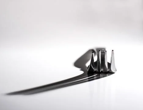 Dinner Fork throws large Shadow Stock Photos