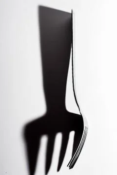 Dinner Fork throws large Shadow. Foto stock