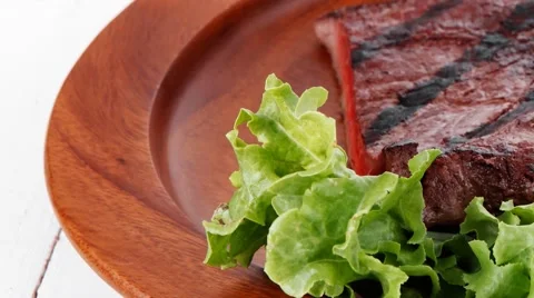 Dinner of fresh rich juicy grilled beef meat steak fillet with m Stock Footage