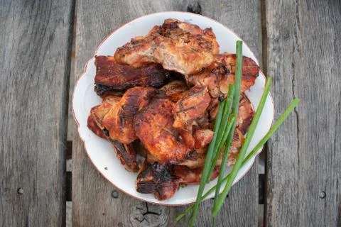 Dinner outdoors The appetizing steaks on the rustic background Stock Photos