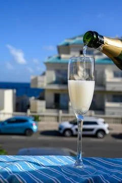 Dinner party, drinking of cava or champagne sparkling wine in vacation reso.. Stock Photos