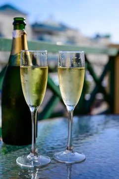 Dinner party, drinking of cava or champagne sparkling wine in vacation reso.. Stock Photos