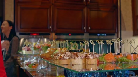 At the dinner party, a laid table for a buffet table, where guests invited to Stock Footage 154097556