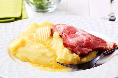 Dinner plate with mashed potatoes and ham Stock Photos