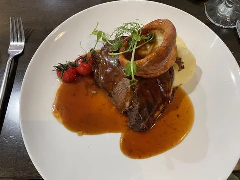 Dinner plate with steak Stock Photos