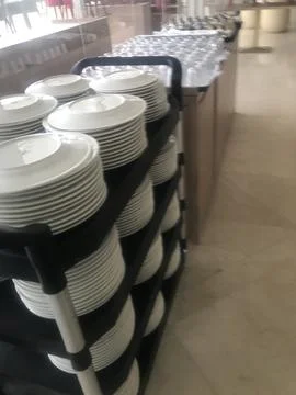 Dinner plates on trolley Stock Photos