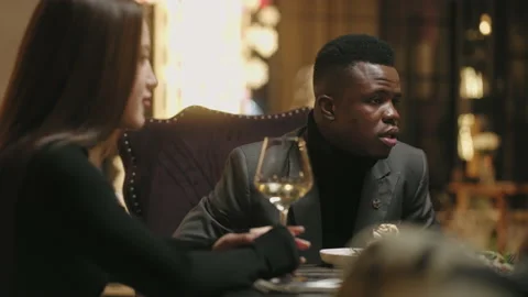 Dinner in restaurant, multi ethnic friends meeting and talking, drinking wine Stock Footage 227937605