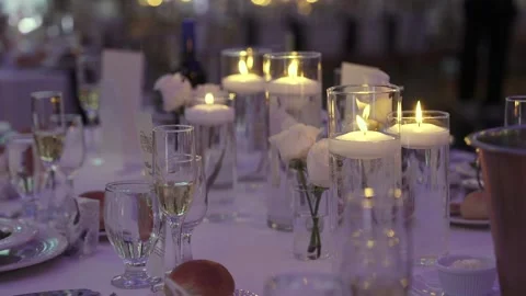 Dinner Setting Elegance, Cozy Festive Table Arrangement Featuring Floating Stock Footage 323773905