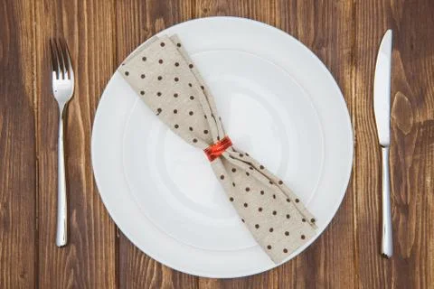Dinner setting, Knife, fork, napkin and dinner plate 스톡 사진