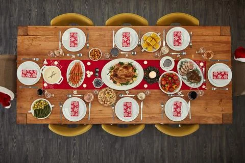 Dinner, table and Christmas lunch with food at an event from top view or above Stock Photos