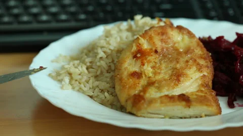 Dinner on table and computer keyboard Stock Footage 50950764
