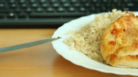 Dinner on table and computer keyboard Stock Footage 50950951