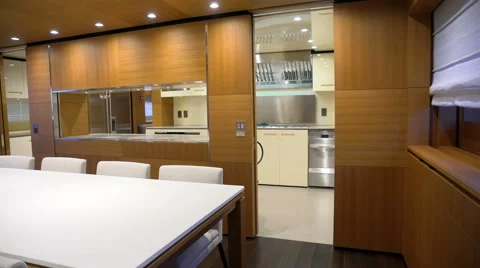 Dinner table and kitchen on a luxury yacht Stock Footage 60389307