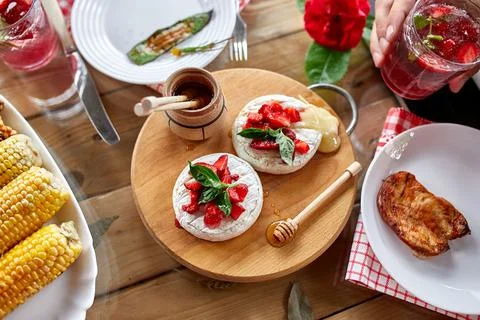 Dinner table appetizers variety serving on party outdoor table at home. Stock Photos