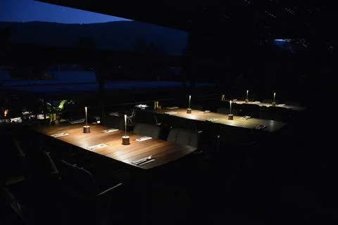 Dinner table in darkness Stock Photos