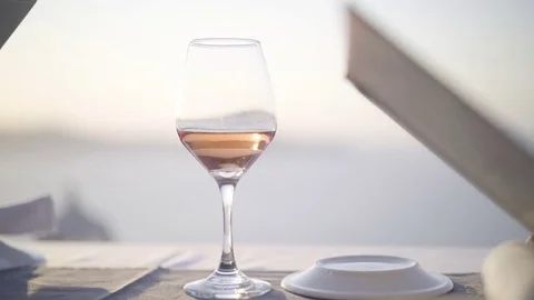 Dinner table detail rose wine glass and menu Stock Footage 80266523