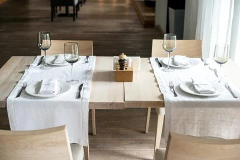 Dinner table in a restaurant or cafe serving with kitchen utensils Stock Photos