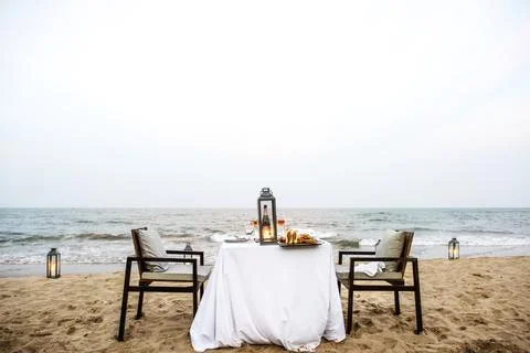 Dinner table by the sea Stock Photos