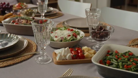 Dinner Table Served with Fresh Mediterranean Dishes for Family Feast Stock Footage 340329755