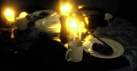 Dinner table set with candles creating an intimate atmosphere in dim lighting Stock Illustration